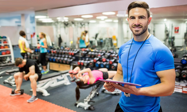 Corporate fitness trainer leading a workplace class