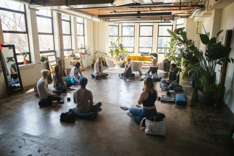 Group meditation session at a workplace wellness event